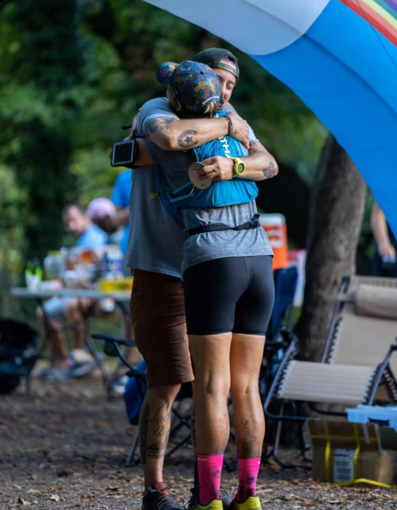 Runners hugging post race