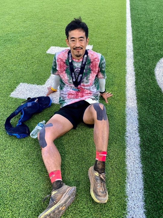 Akira Yamada relaxing at the finish. 