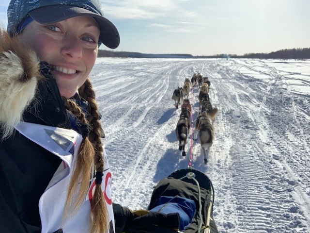 Professional sled dog racer, Anna, with her team.