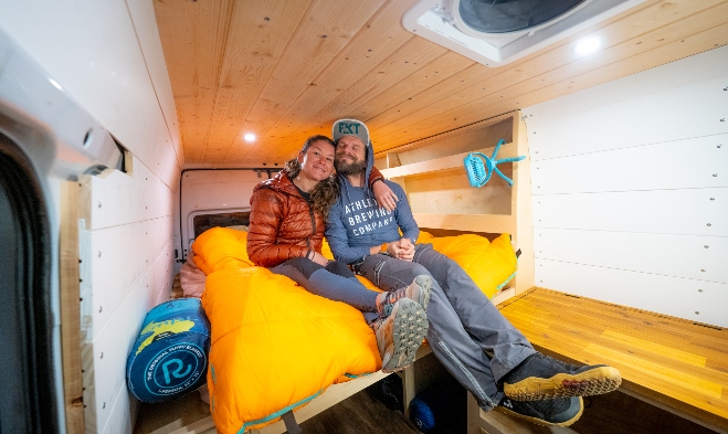 The FKT power-couple relaxing in their van.