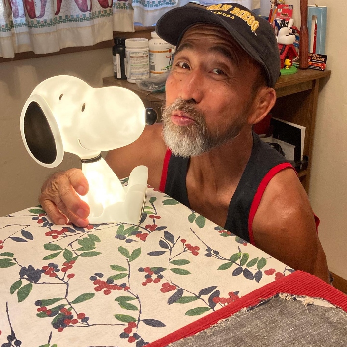 Kuni hanging with his mentor, Snoopy.