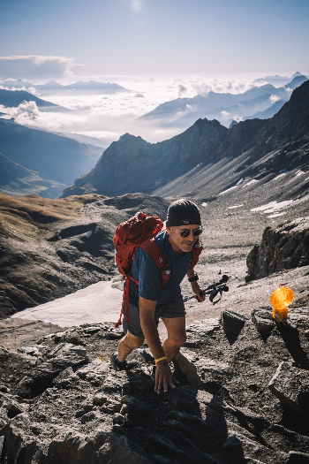 Doug Mayer tackles the climb to dramatic Col Malatra. Photo by Sam Hill.