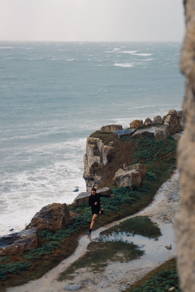 Andy Sloan creating his own balance running around the Isle of Portland.