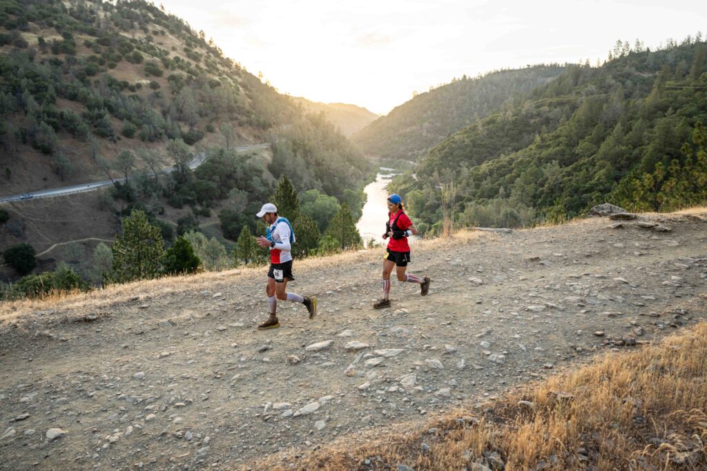 Garett Carolus runs past the Middle Fork of the American River