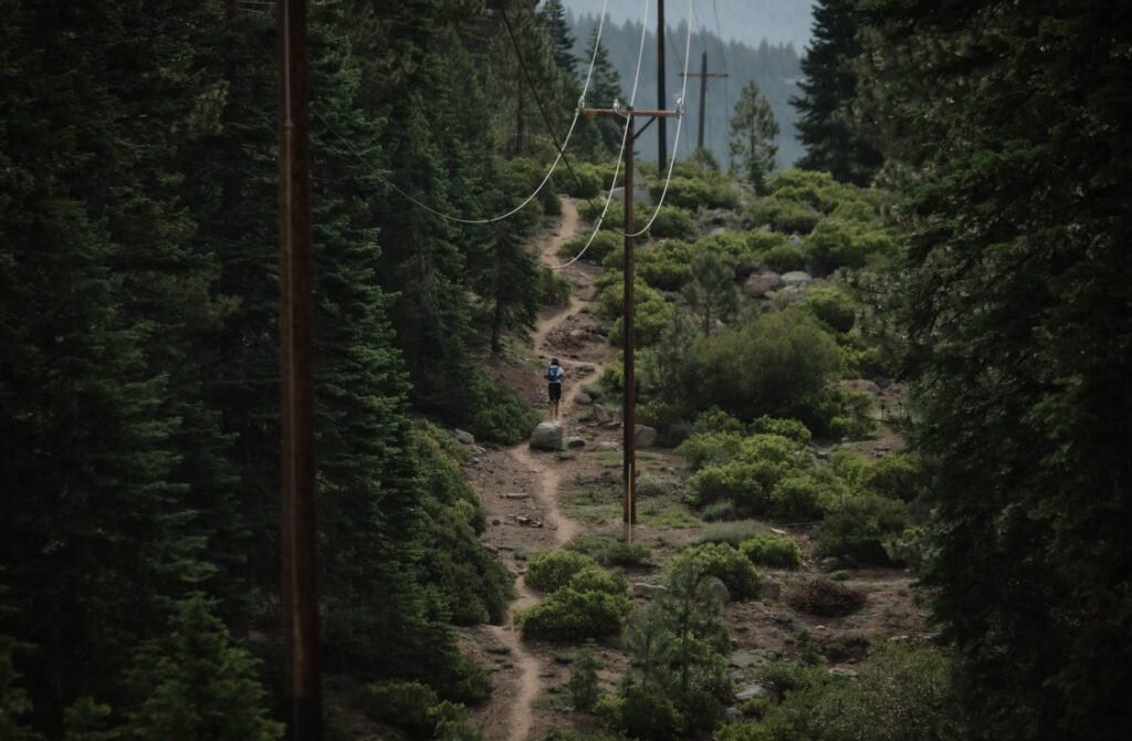 Runners gain an incredible view of Lake Tahoe before descending down the powerline climb.