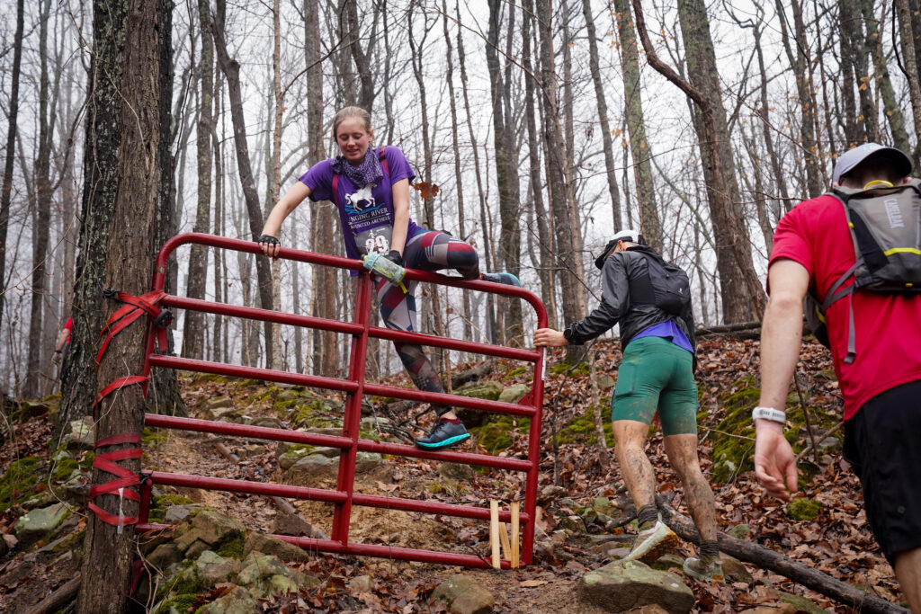 The iconic red gate on the course is placed in a different location each year. It honors local runner DeWayne Satterfield who passed away of a rare heart cancer. By Pete Schreiner.