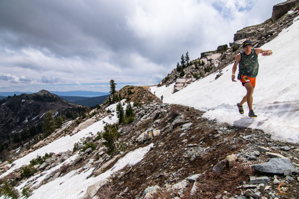 Runners traversing snow field